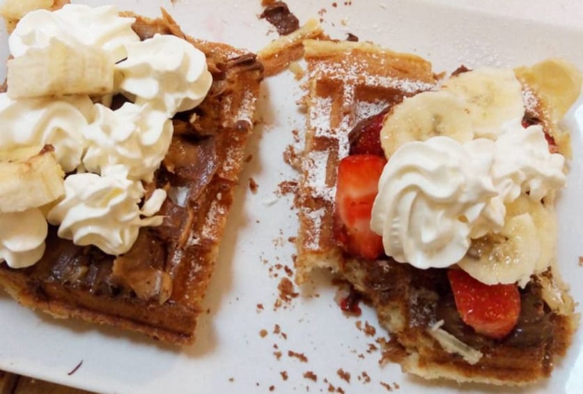 Belgian waffles with fruit and whipped cream in Brussels
