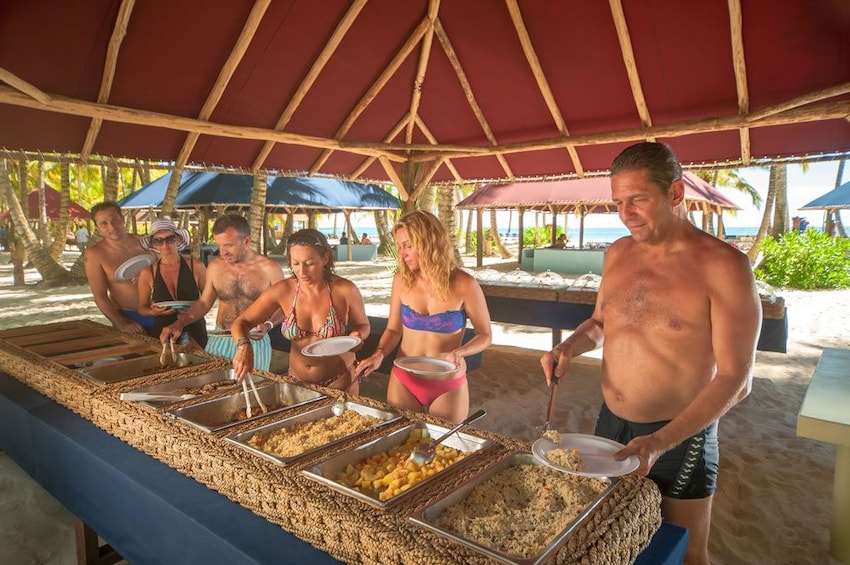 Guests enjoy a buffet lunch on Saona Island