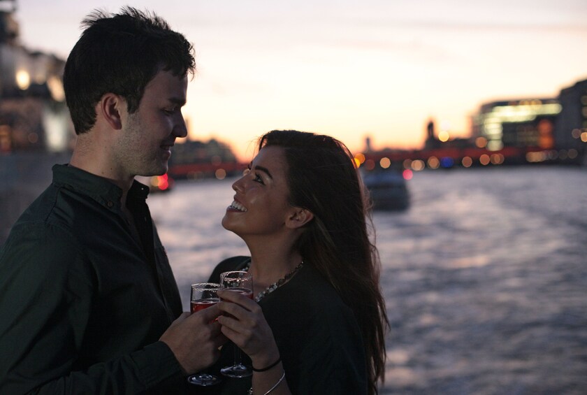 Couple on a evening cruise on the River Thames