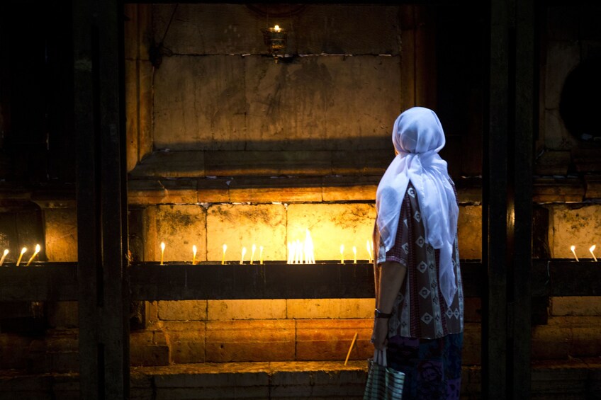 Person in a place of worship in Jerusalem