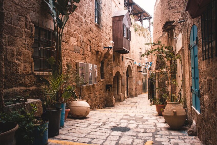 Narrow pedestrian walkway between buildings in Tel Aviv