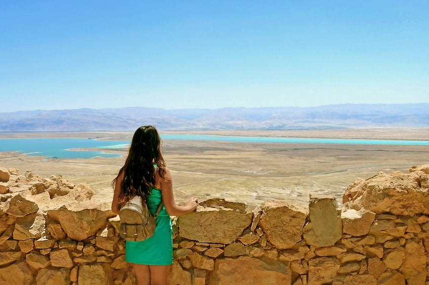 Woman admiring the amazing views of the Judean Desert and the Dead Sea