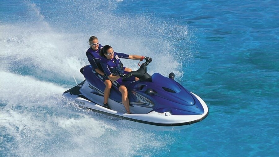 Two ladies having fun on a jet ski in the Northern Coast of Menorca