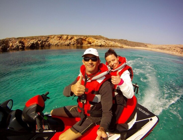 Couple on a jet ski adventure in Northern Coast of Menorca
