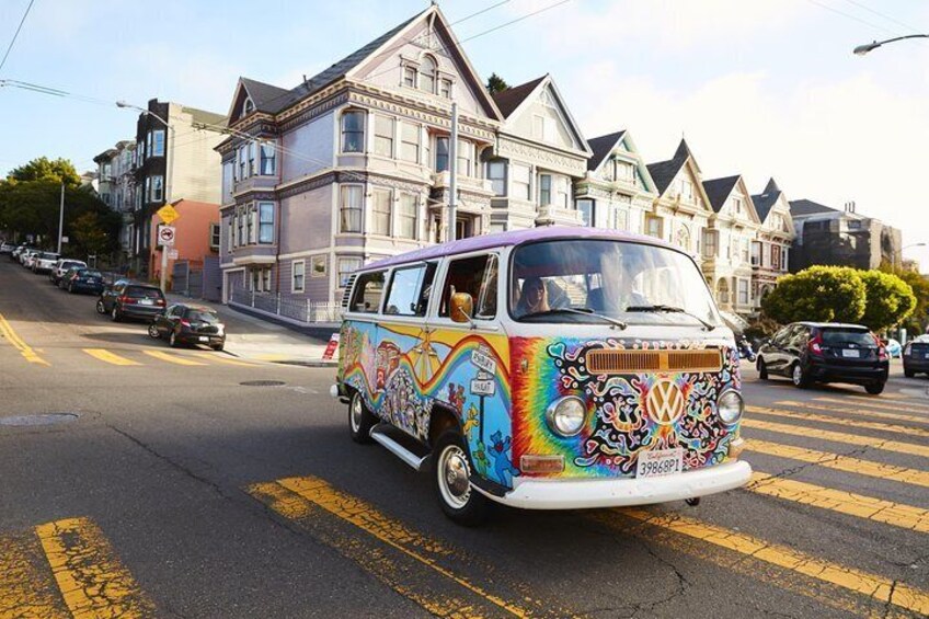 Psychedelic paintwork on this VW camper van juxtaposes sharply against the pastel San Fran houses in the background.