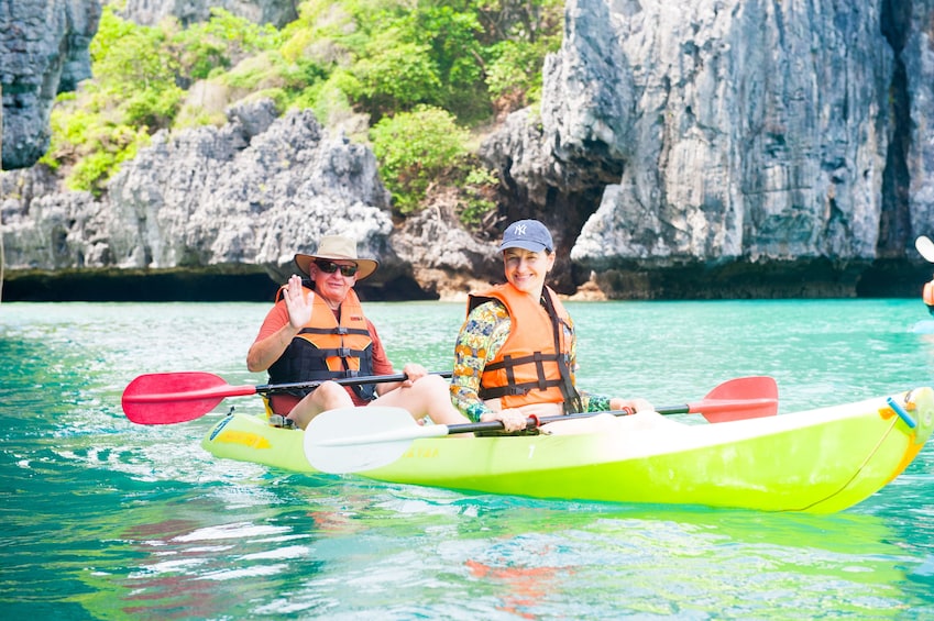 Close view of a woman and man kayaking at Angthong Marine Park 