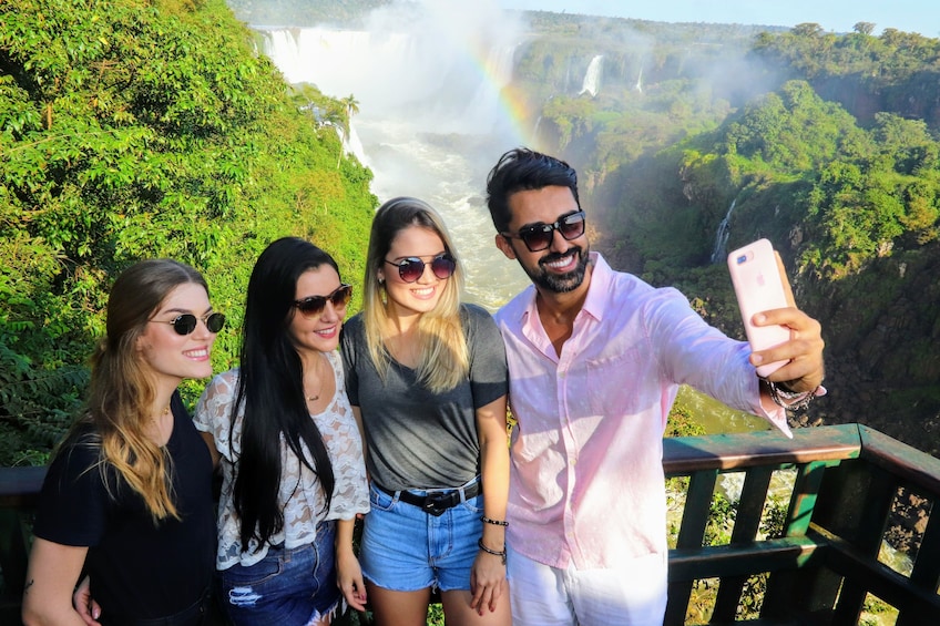 Group taking a selfie with a mobile phone at Iguassu Falls