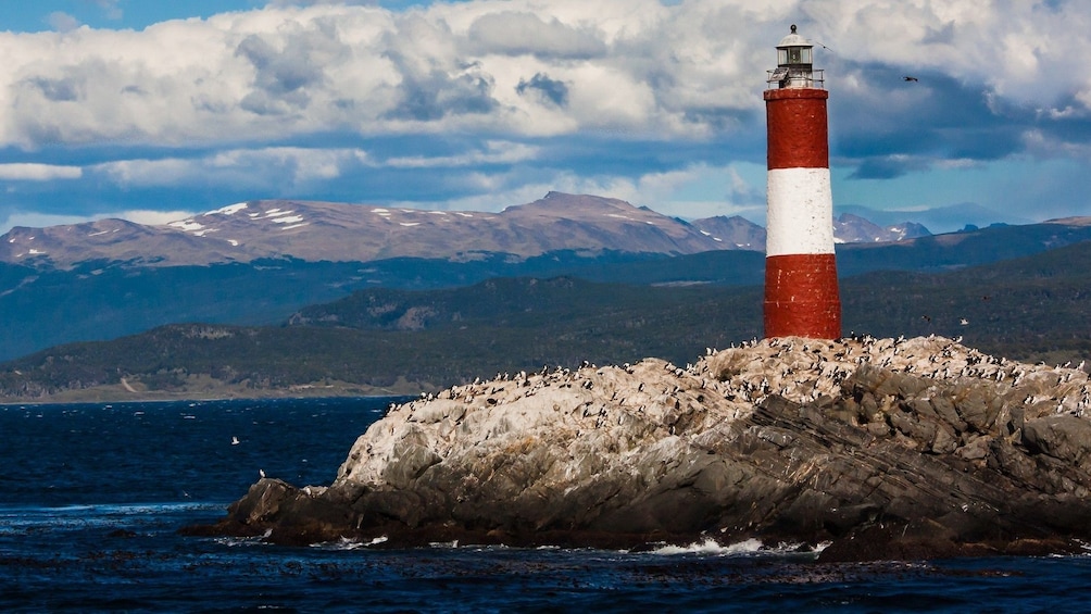 Red and white lighthouse on Isla Martillo in Beagle Channel, 