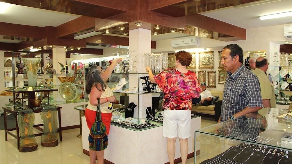 Tourists admire souvenirs at Cabo San Lucas gift shop