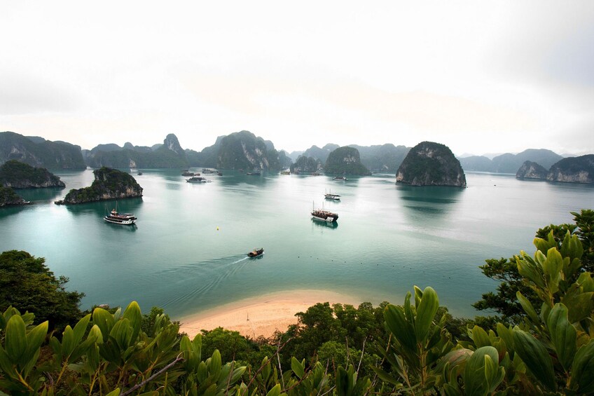 Panoramic view of beach, boats and islands in Halong Bay, Vietnam
