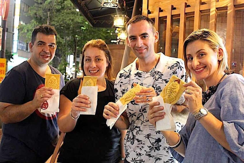 Group trying Taiyaki in Ginza 