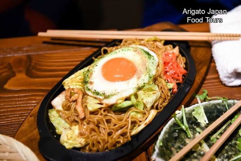 Hot plate of food and a bowl of salad in Ginza