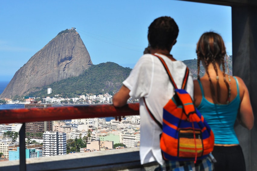Tourists look out at Corcovado Mountain in Brazil
