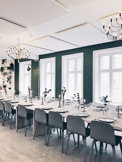 Show item 3 of 9. Large dining table with place settings in a white and blue room