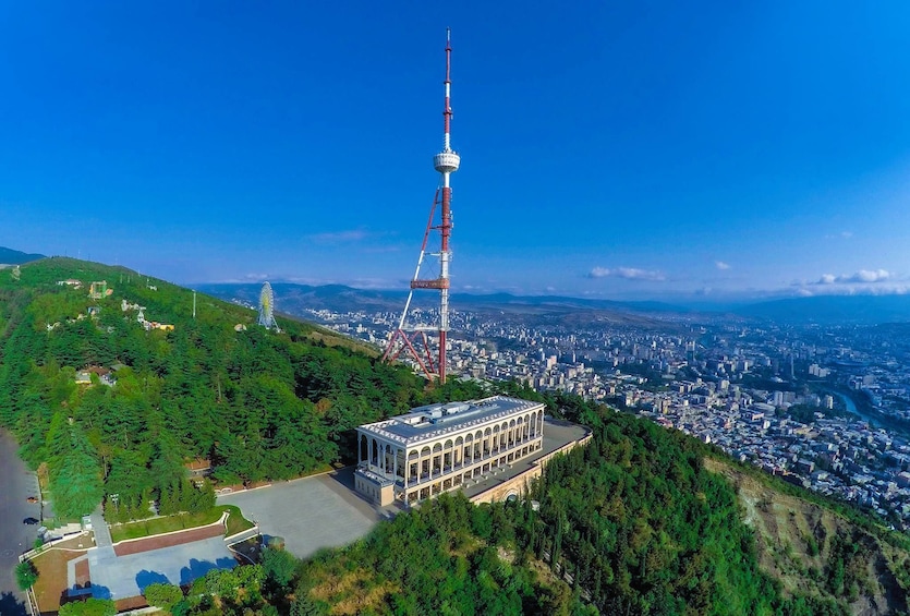 Show item 1 of 4. Building at top of a mountain in Tbilisi
