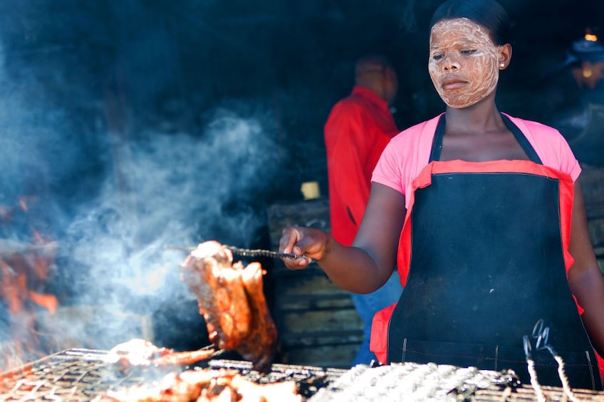 Woman grilling food in Cape Town