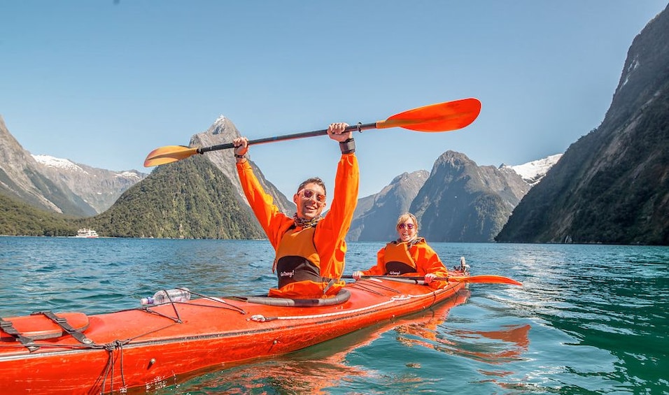 Couple on a kayaking trip on the Milford Sound
