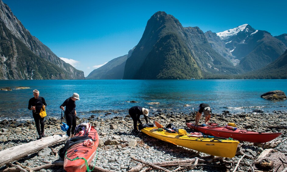 Landscape view of a group on a kayaking trip at the Milford Sound 