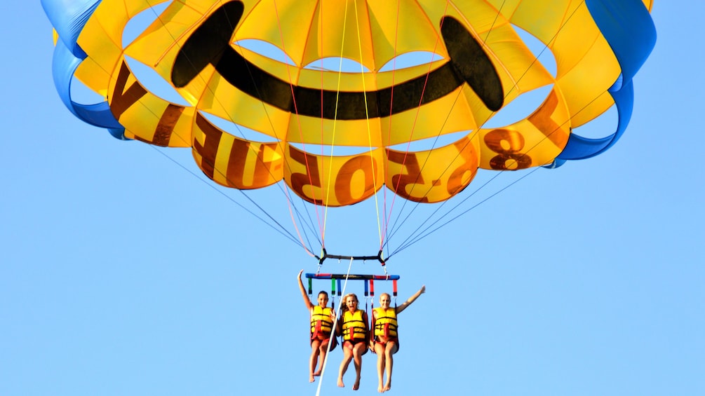 Three people parasailing in Miami