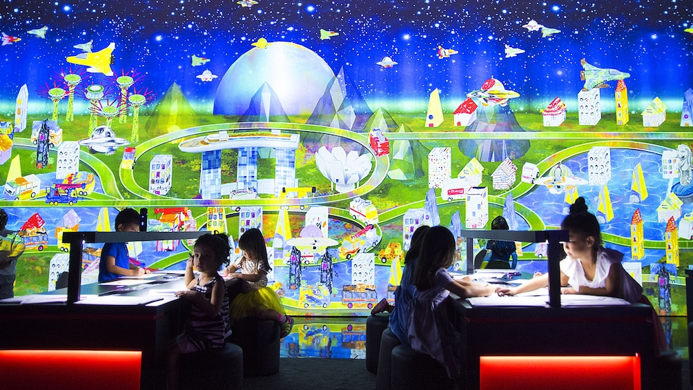 Kids playing with interactive exhibit at the Art Science Museum in Singapore