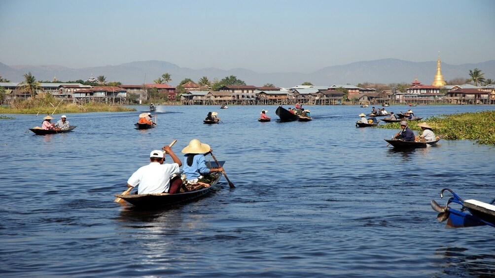 People row small boats in Inle Lake in Myanmar