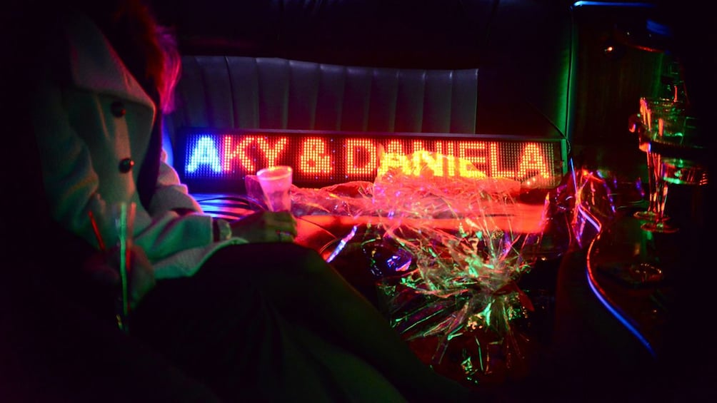 Names lit up inside a limo in Paris