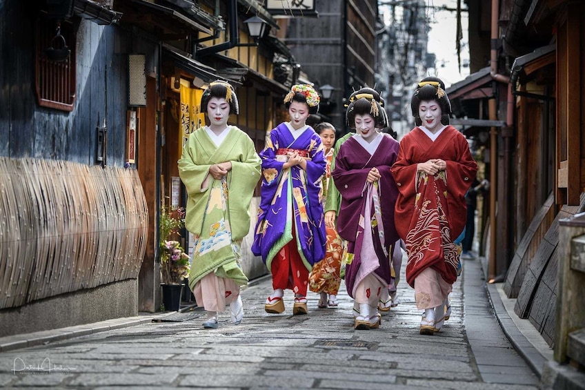 Four women dressed as Geishas