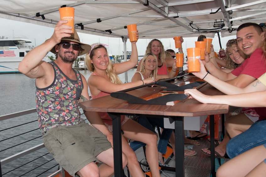 Cycleboat passengers holding up their drinks in Florida