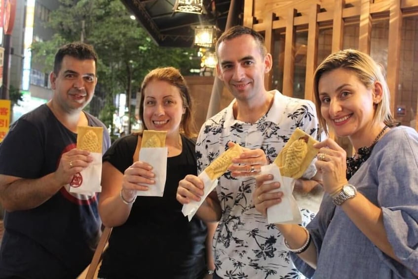 Group enjoying Taiyaki in Shinbashi 