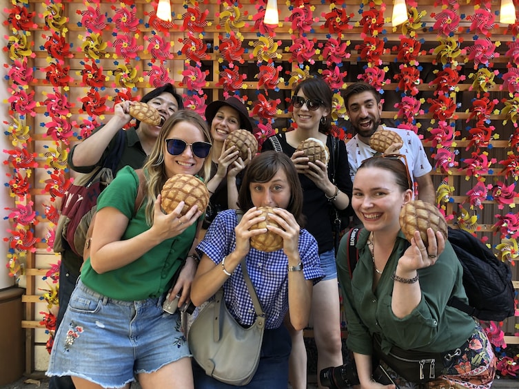 Tour group holding pastries in Tokyo 