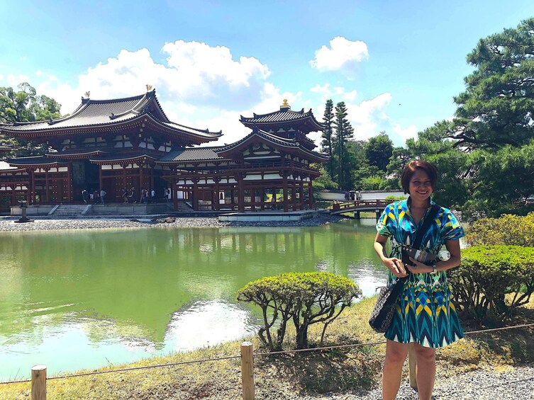 Woman stands outside a Pagoda in Kyoto