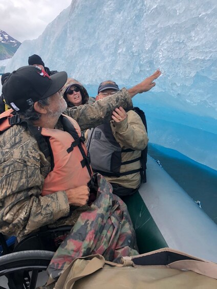 Group close up to an iceberg in Alaska 