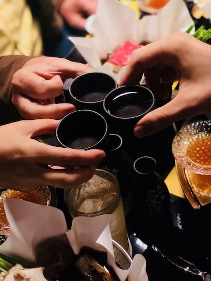 Guests trying sake in Kyoto