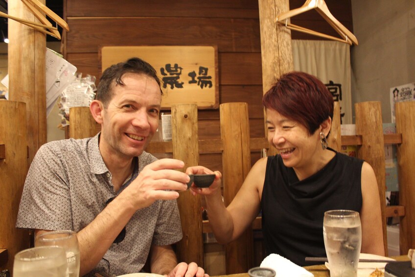 Couple enjoying sake in Kyoto