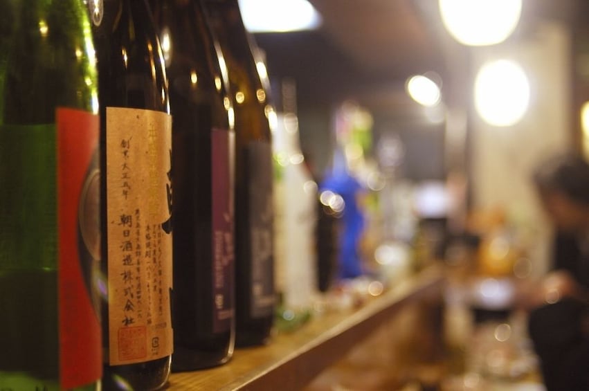 Shelf full of bottles of wine and sake in Tokyo 