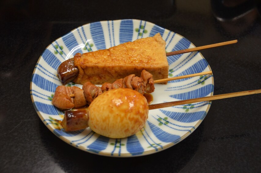 Food on sticks on a plate