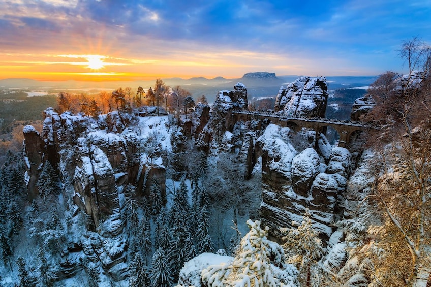 Bridge and snow-covered rock pillars in Switzerland