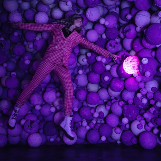 Man lays in Amethyst Ball Cavern at Moco Museum in Amsterdam