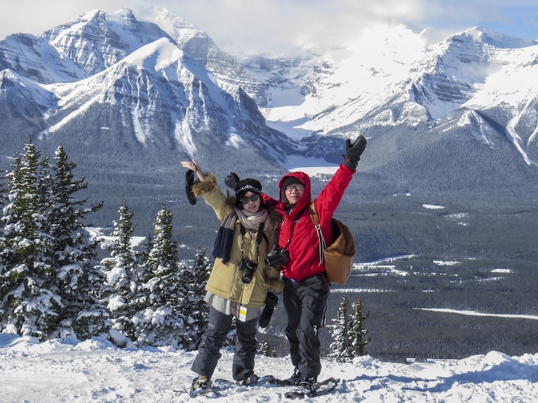 Couple on a snowshoe tour of Lake Louise