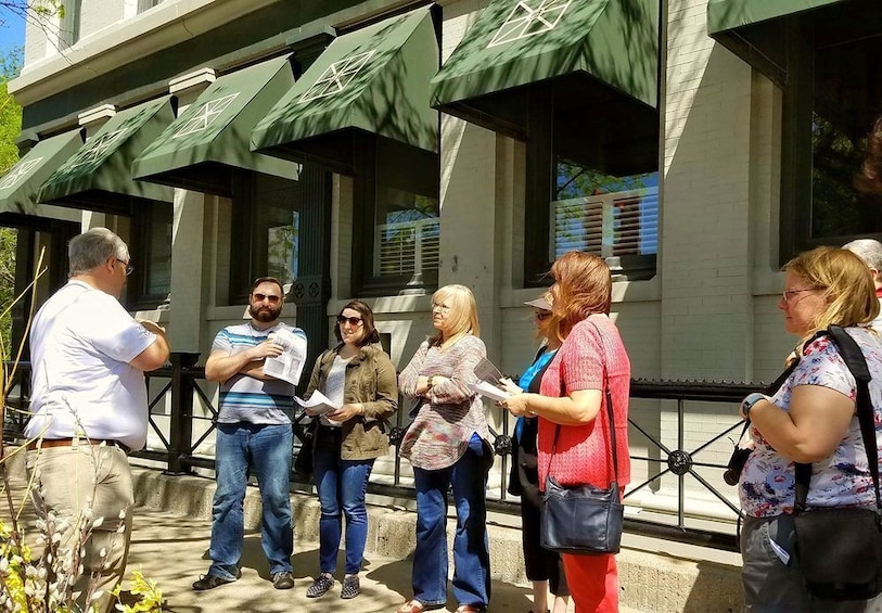 Show item 1 of 5. Tour guide with group in Omaha