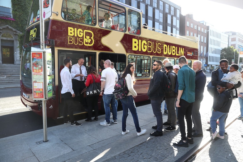 Tour group getting on the Dublin Hop-On Hop-Off Bus 