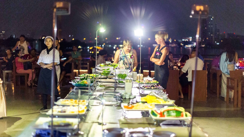 Buffet of Thai and International dishes and desserts aboard the River by Night Dinner Cruise on Chao Phraya River in Bangkok

