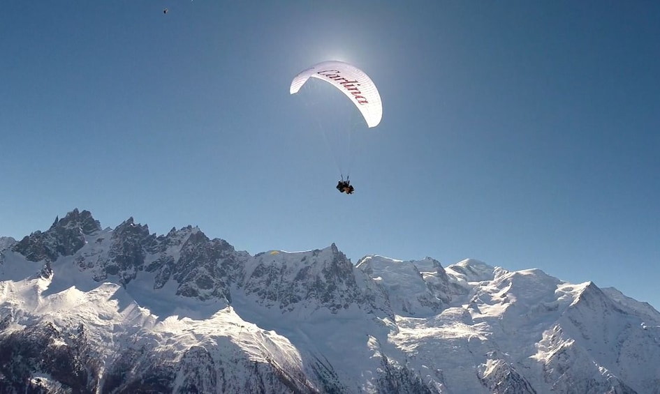 Show item 3 of 10. View of paragliders over Mont Blanc in France