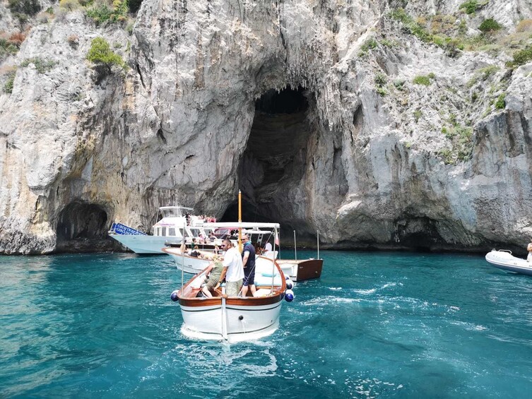 Boat cruise through Faraglioni island in Italy