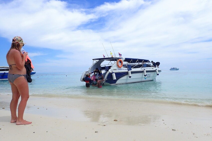 Woman standing near a speed boat in Koh Lanta