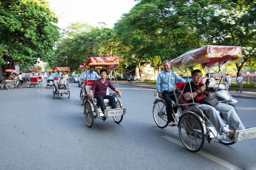 People in rickshaws in Hanoi