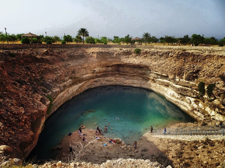 People swimming in the Bimmah Sinkhole in Oman