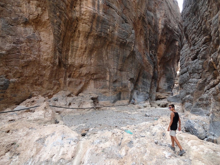 Tourist hiking through the canyon Wadi