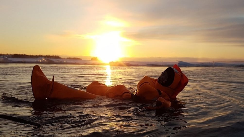 Guest floating in the Finnish forest lake in Rovaniemi