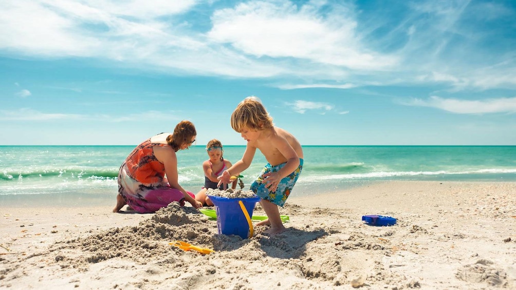 Mother and kids play on Clearwater Beach in Florida